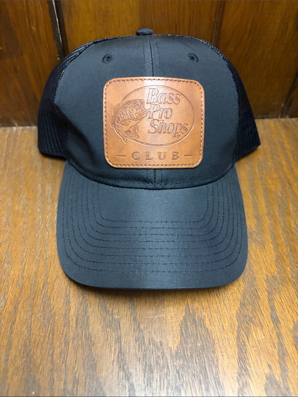 Bass Pro Shops Club Black Trucker Hat with Brown Leather-like Patch